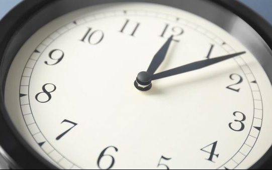 Time For Change Clock A clock laying on its back. The small hand is on 12 while the big hand is on 2.